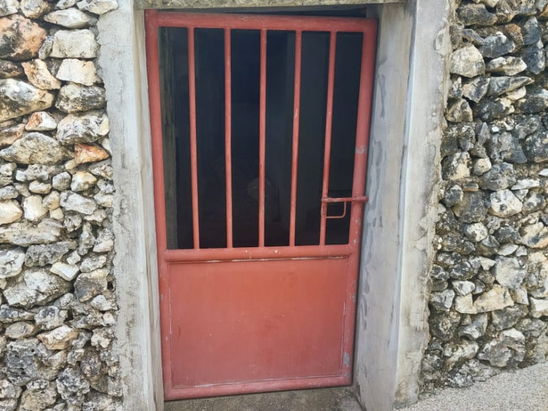 Large basement room with concrete walls