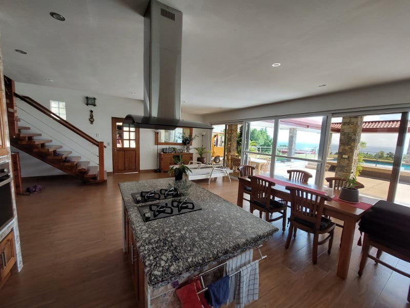 Living room with seating and staircase