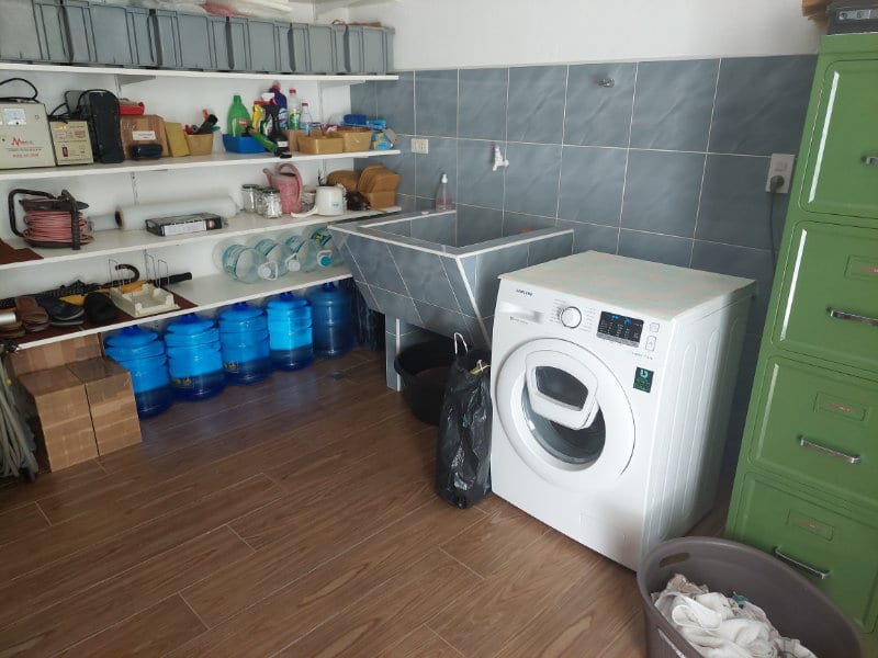 Washroom with washing machine and storage